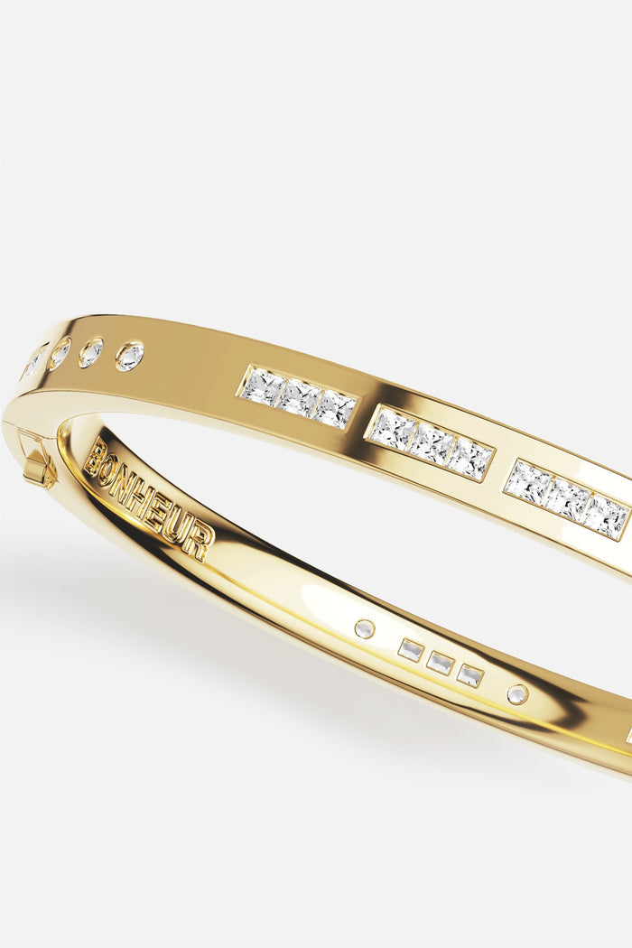 APM Bonheur Bangle, a golden promise of quiet luxury and everyday radiance.