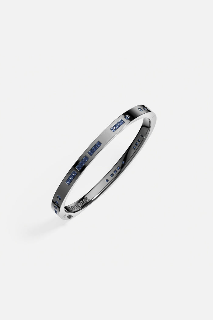 APM Bangle in rhodium finish, midnight blue stones whispering quiet modern elegance.