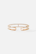 APM open cuff bracelet in warm rose color, sparkling with modern elegance.