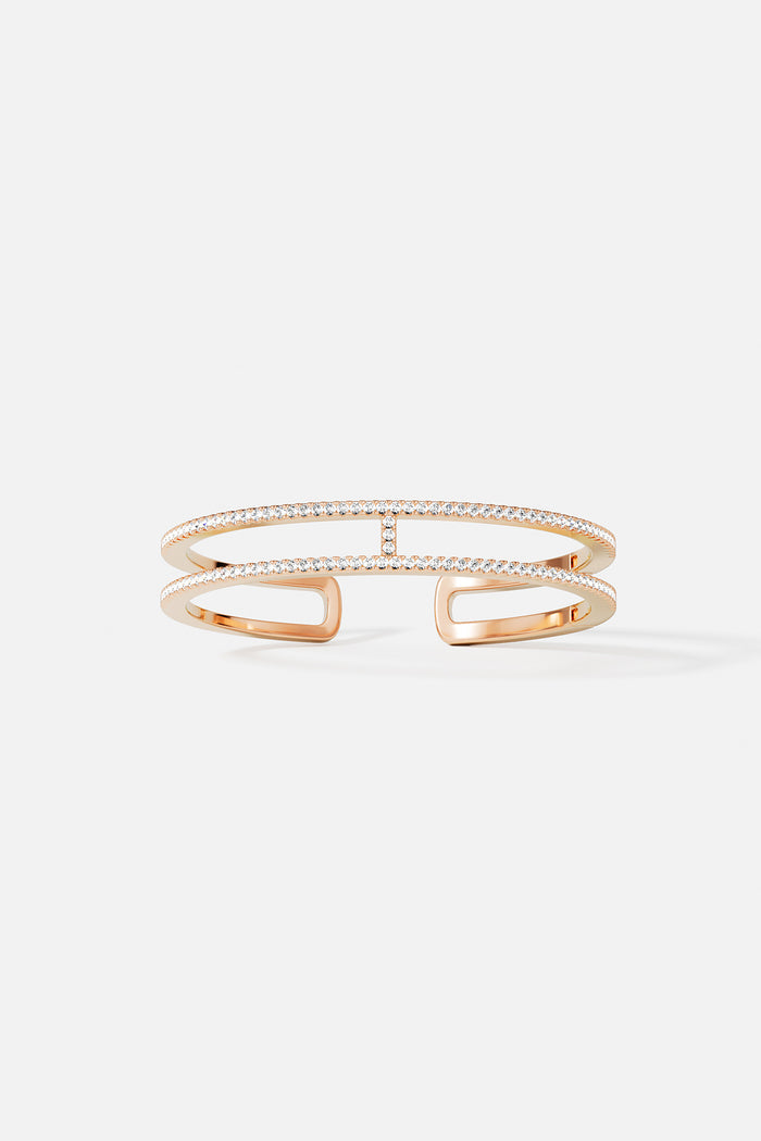 APM open cuff bracelet in warm rose color, sparkling with modern elegance.