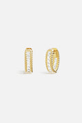 APM Hoop Earrings, twisted golden ropes framing a luminous crystal line.