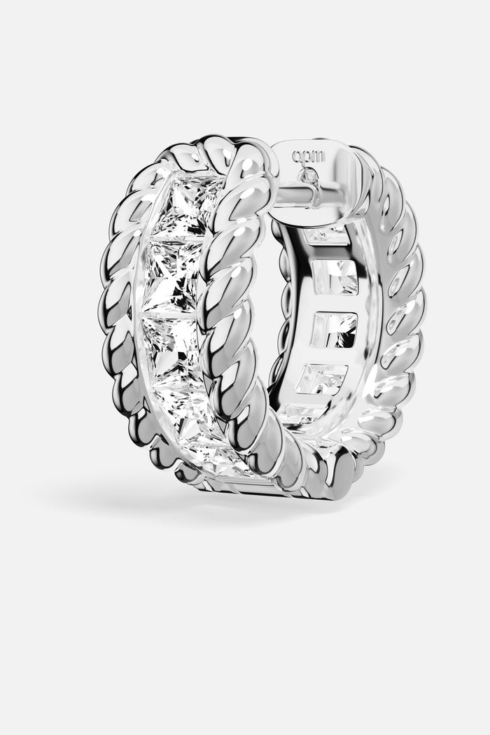 APM Hoop Earring in rhodium finish, twisted edges framing brilliant light, effortlessly bold.