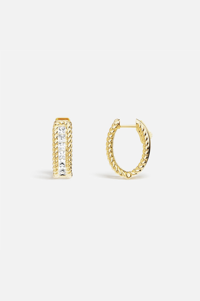 APM Hoop Earrings, twisted golden ropes framing a luminous line of light.