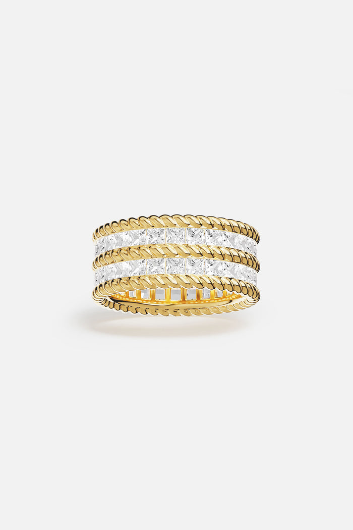 APM Ring, twisted golden lines and crystal brilliance, quietly bold elegance.