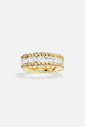 APM Ring in gold color, twisted edges framing a luminous crystal path.