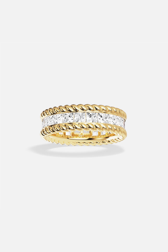 APM Ring in gold color, twisted edges framing a luminous crystal path.