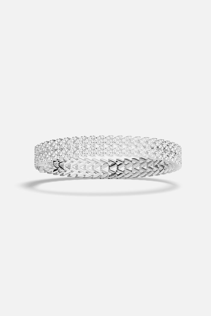 APM Bracelet in rhodium finish, a shimmering embrace of quiet radiance.