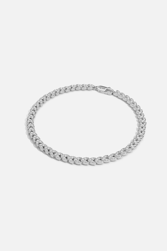 APM Necklace in rhodium finish, a shimmering curb chain radiating effortless modern elegance.