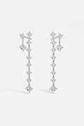 APM Drop Earrings cascading in luminous rhodium finish, effortlessly radiant.