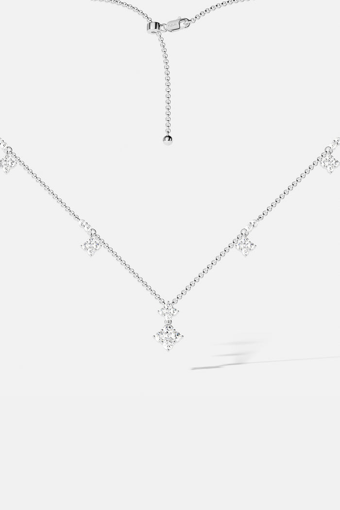APM Necklace with delicate sparkling charms, a whisper of modern elegance in rhodium finish.