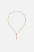 APM Necklace in golden color, a delicate teardrop falling with quiet elegance.