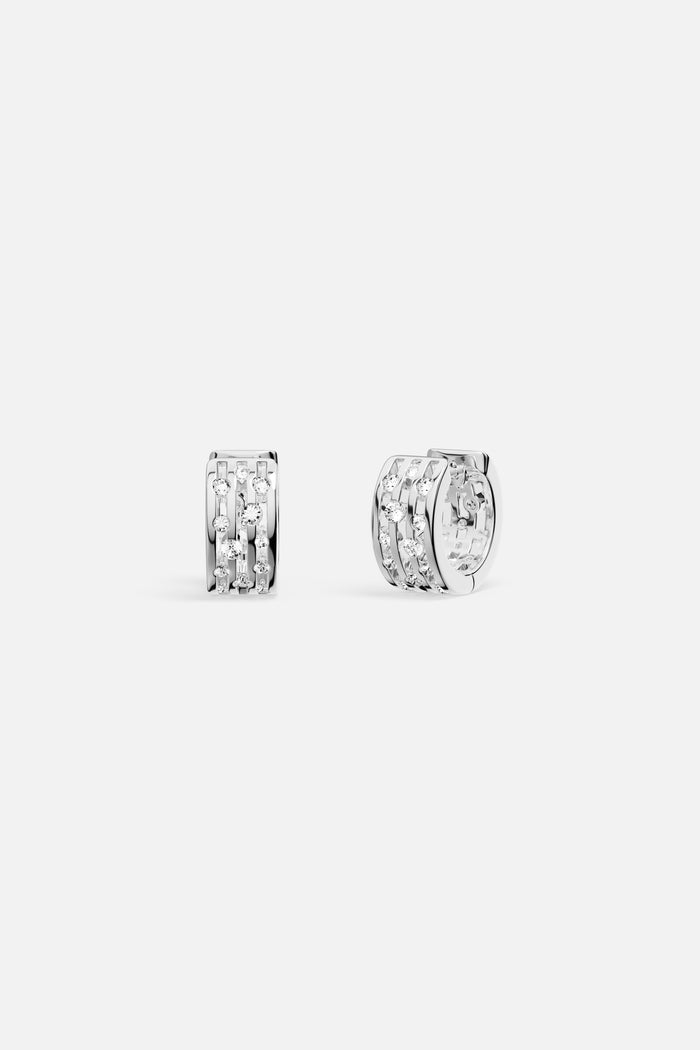 APM Hoop Earrings in rhodium finish, sparkling with modern architectural elegance.