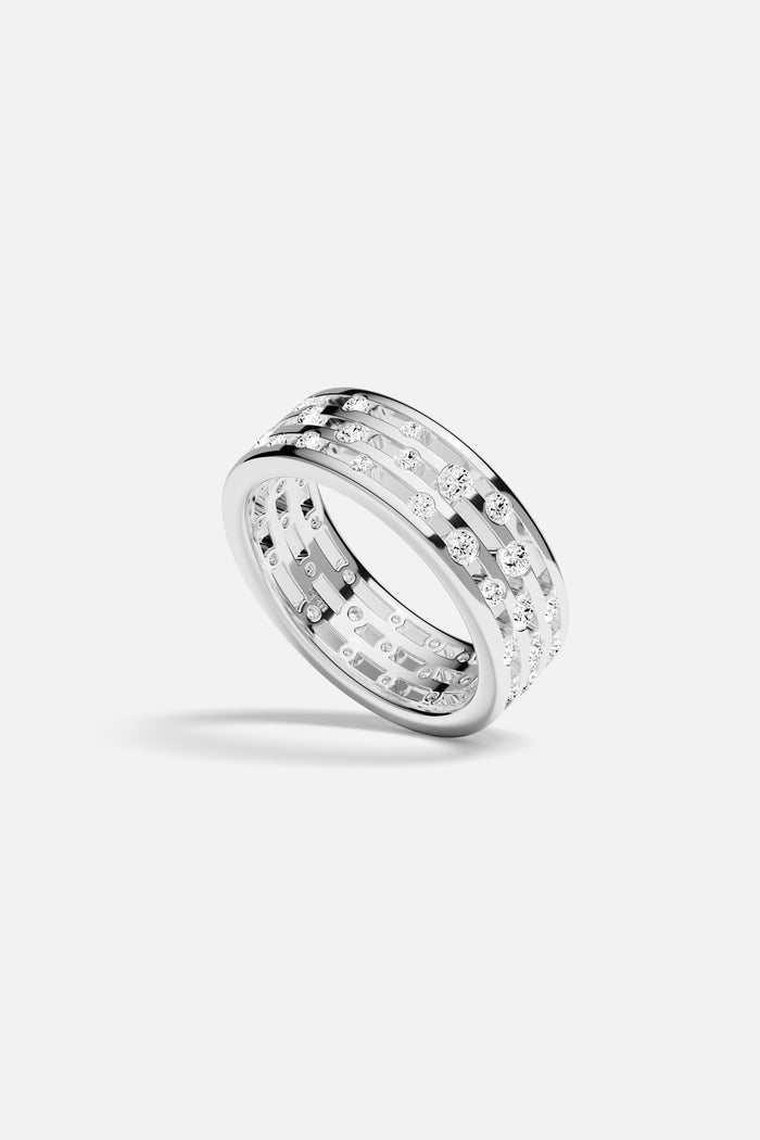 APM Ring in rhodium finish, a luminous statement of modern elegance.