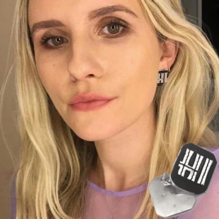 Sometimes, it's best to keep things short and sweet. Like these new pierced "statement" earrings! Sterling Silver Pop Art Letters surrounded by Black Enamel, reveal the word "HI", disarmingly dangling from your ears. Fun, friendly, daring, stylish and timeless.  INTRODUCING Sterling Silver and Black Enamel Dangling Conversation"HI Earrings at a special price!  Handmade in the good ole USA and hand signed.  Pierced posts.