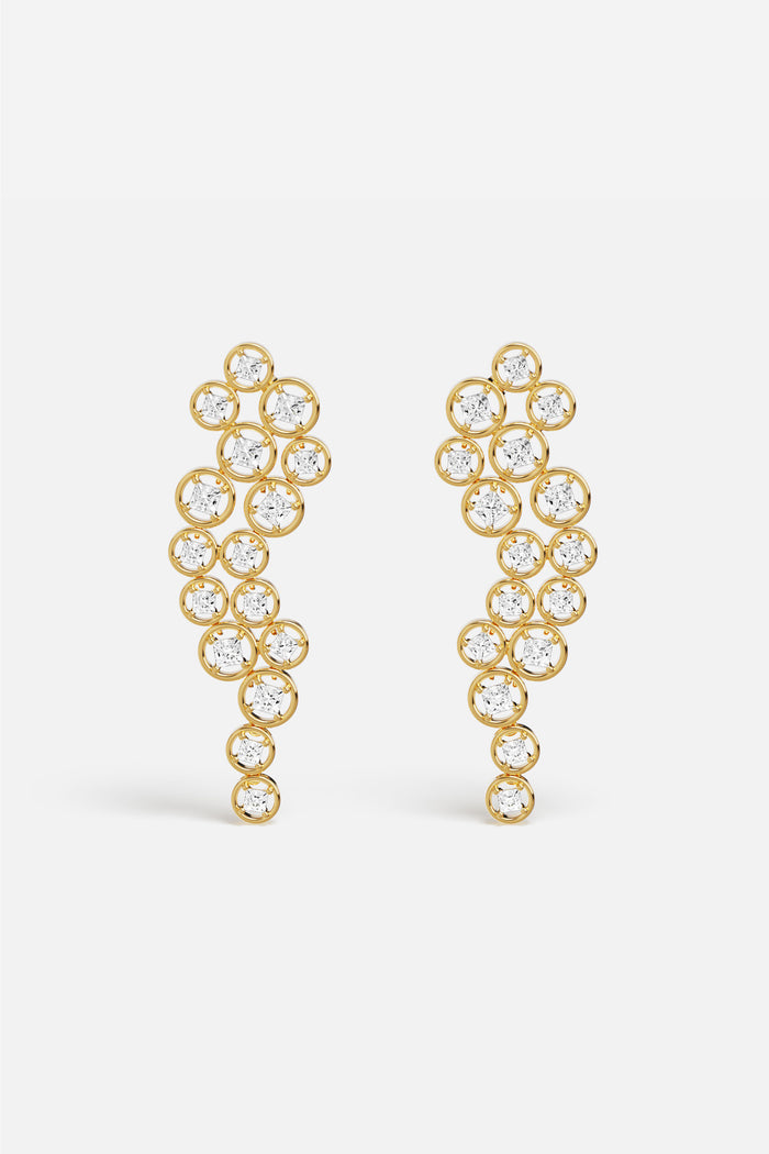 APM Earrings in golden color, a cascade of light with effortless elegance.