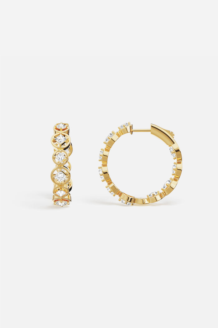 APM Hoop Earrings in golden color, radiant sparkle circling every moment with quiet elegance.