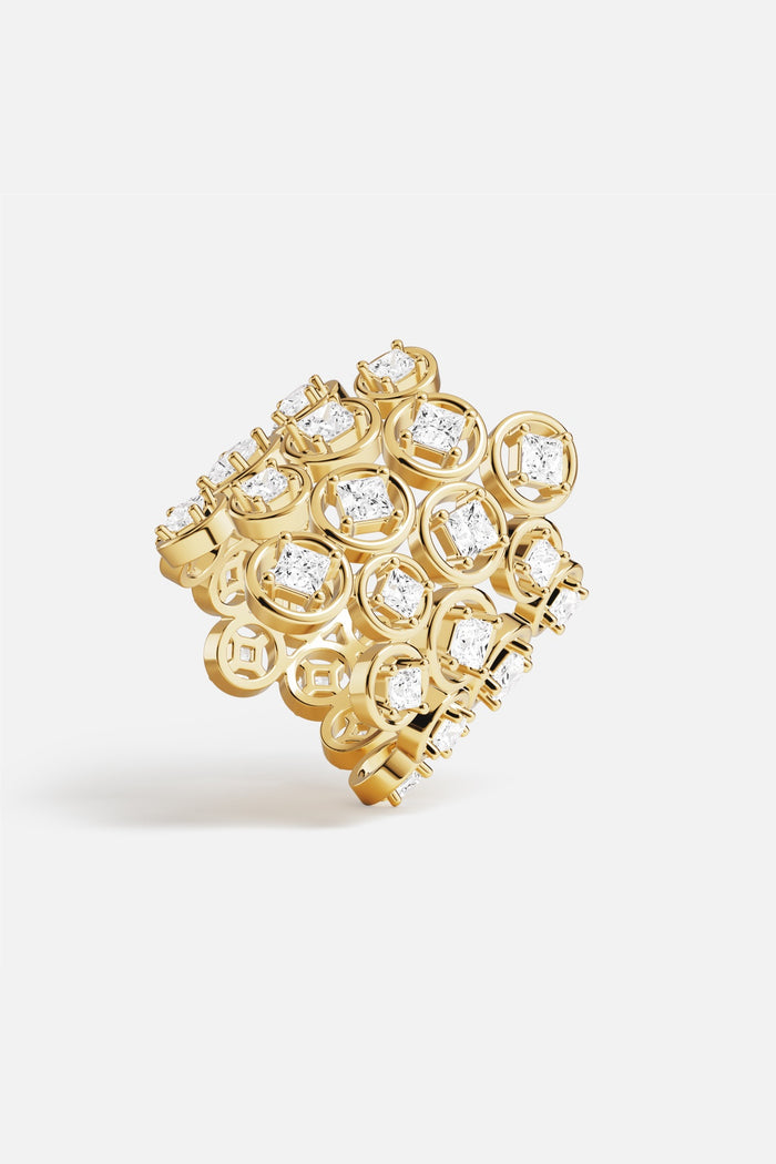 APM Monaco Ring, a golden constellation of stones shimmering with modern elegance.