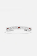 APM Monaco cuff bracelet in rhodium finish, sprinkled with sparkle and deep red accents.