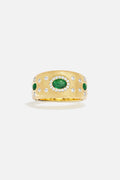 APM Ring in golden hue, brushed finish with emerald accents, quietly regal.