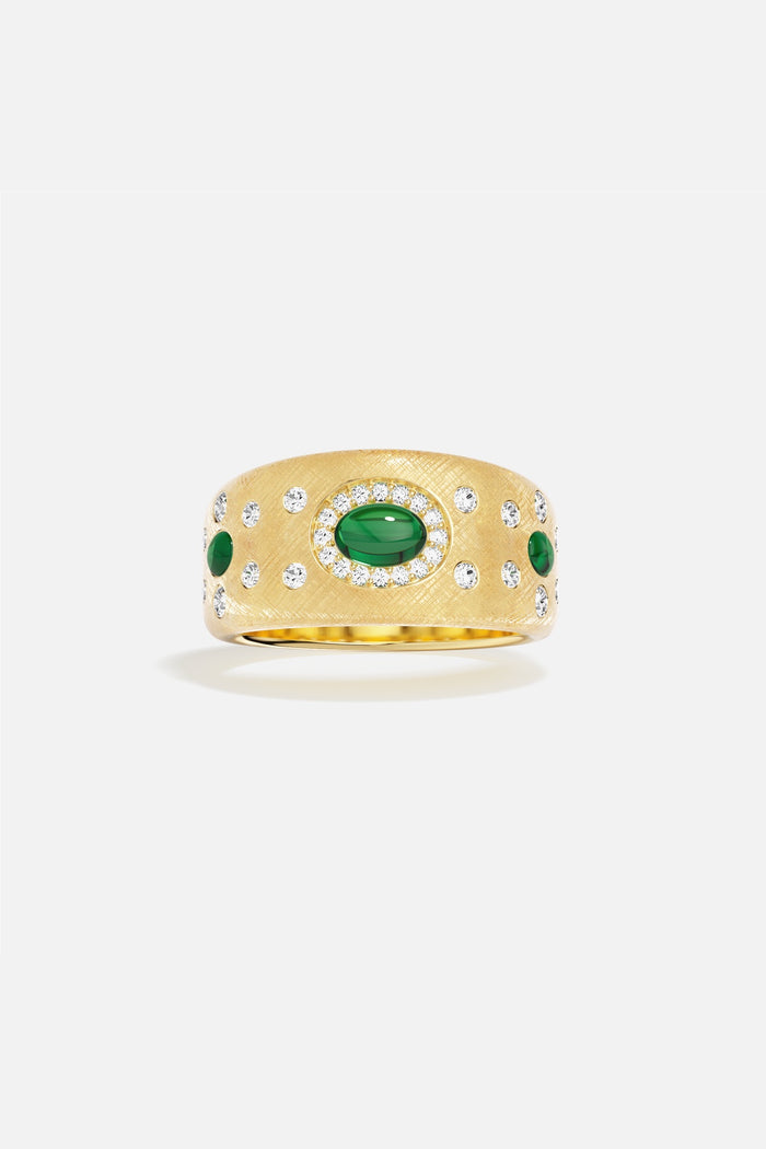 APM Ring in golden hue, brushed finish with emerald accents, quietly regal.