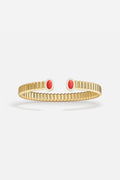 APM Bangle in golden color, ribbed elegance meeting bold red accents.