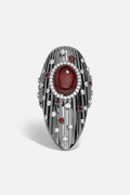 APM Ring, a bold ruby glow scattered with starlit sparkle.