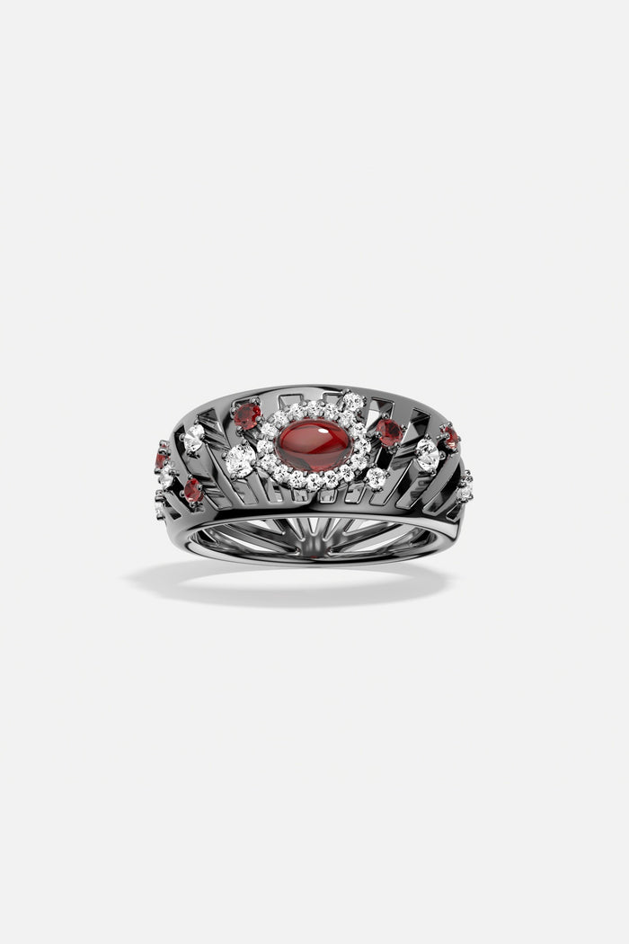 APM Ring in dark rhodium finish, a bold gaze of crimson allure.