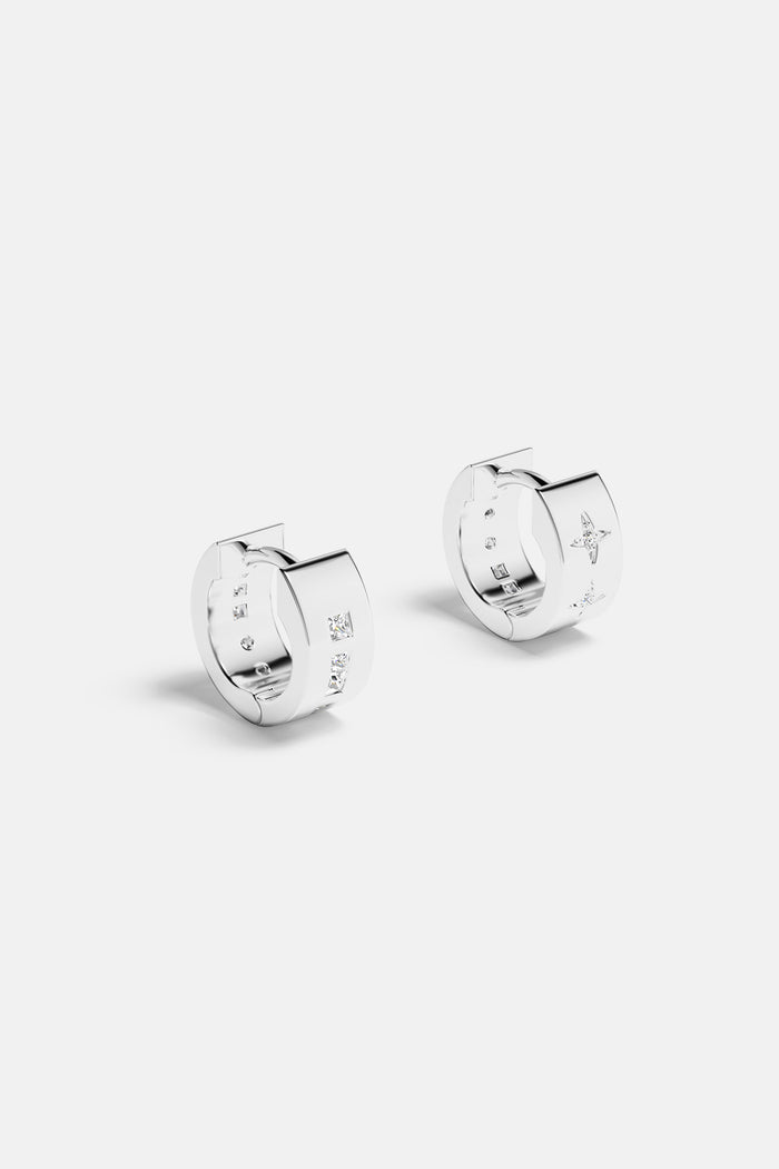 APM Hoop Earrings, a rhodium finish glow with celestial sparkle.