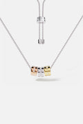 APM Necklace with three tri-color rings, an effortless play of modern elegance.