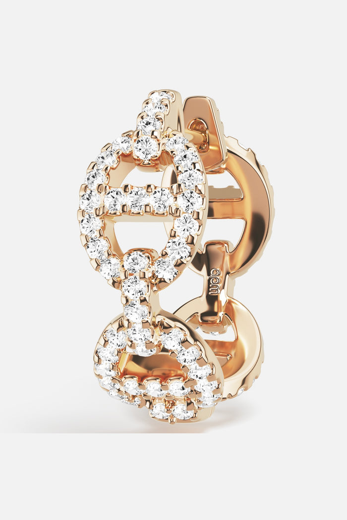 APM Morse Earrings in rhodium finish, linked brilliance with a golden glow.