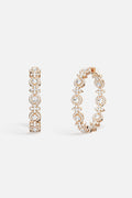 APM Hoop Earrings, a shimmering constellation of light for effortless radiance.