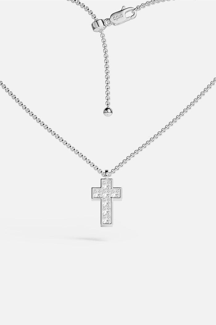 APM Cross Necklace, a luminous rhodium finish icon of quiet devotion.