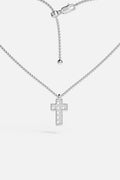 APM Cross Necklace, a luminous rhodium finish icon of quiet devotion.