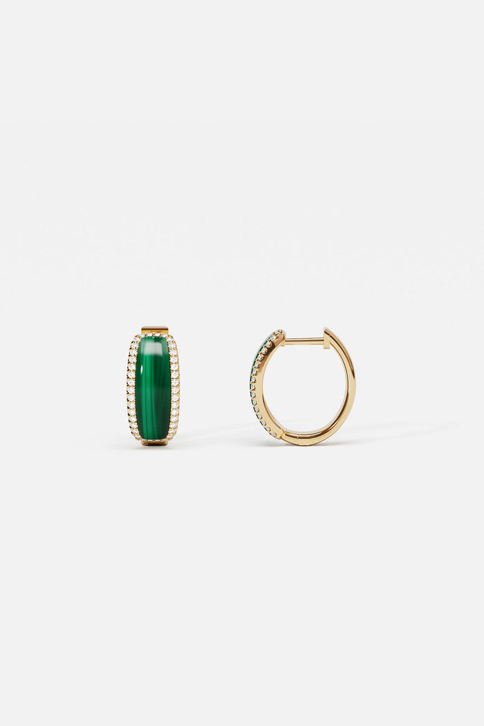 APM Monaco hoop earrings in golden hues and vivid green, quietly radiant elegance.