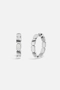 APM Hoop Earrings, a sculptural rhythm with a shimmering pavé statement.