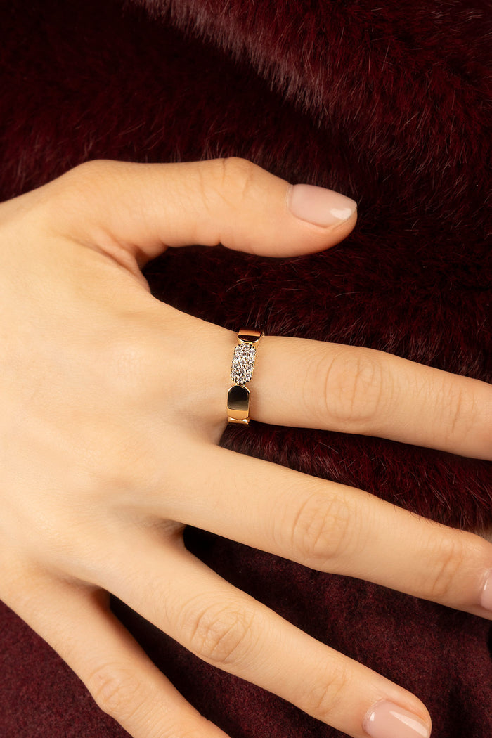 Woman wearing APM Morse Ring, a golden whisper of quiet elegance.