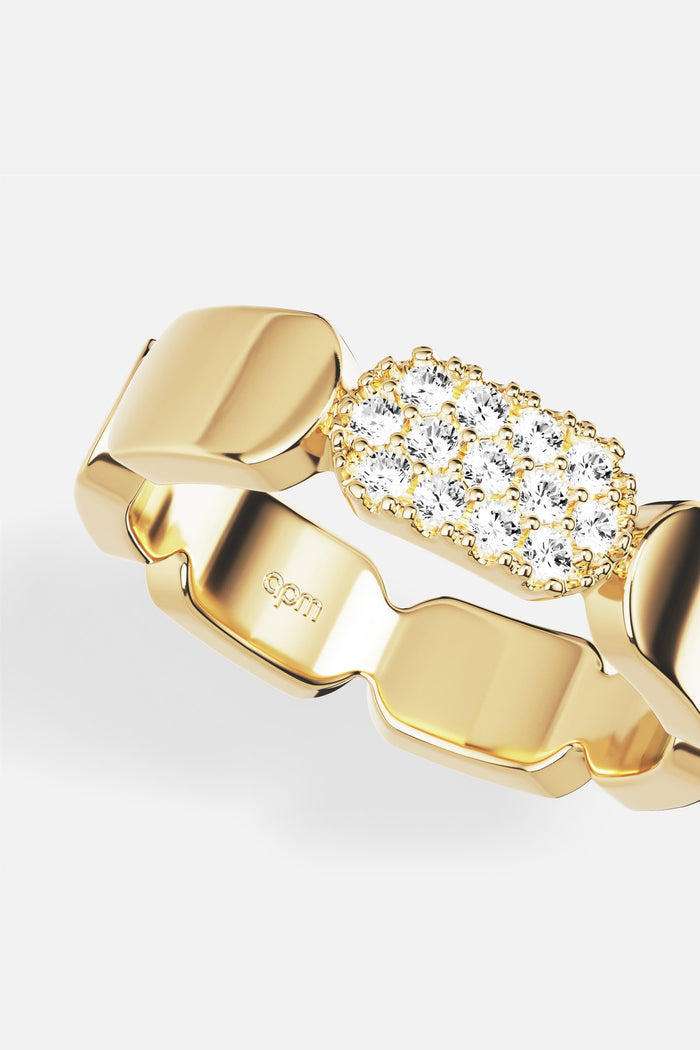 APM Ring in golden color, sculpted links meeting a shimmering pavé glow.