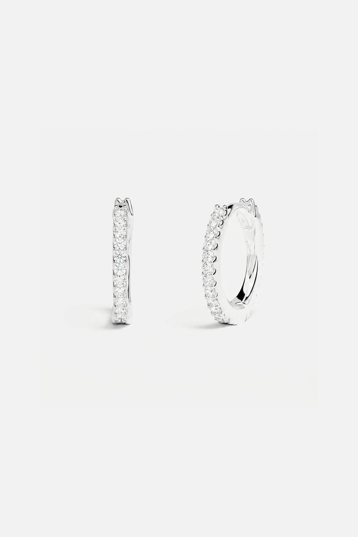 APM Hoop Earrings in rhodium finish, a delicate sparkle for effortless everyday elegance.