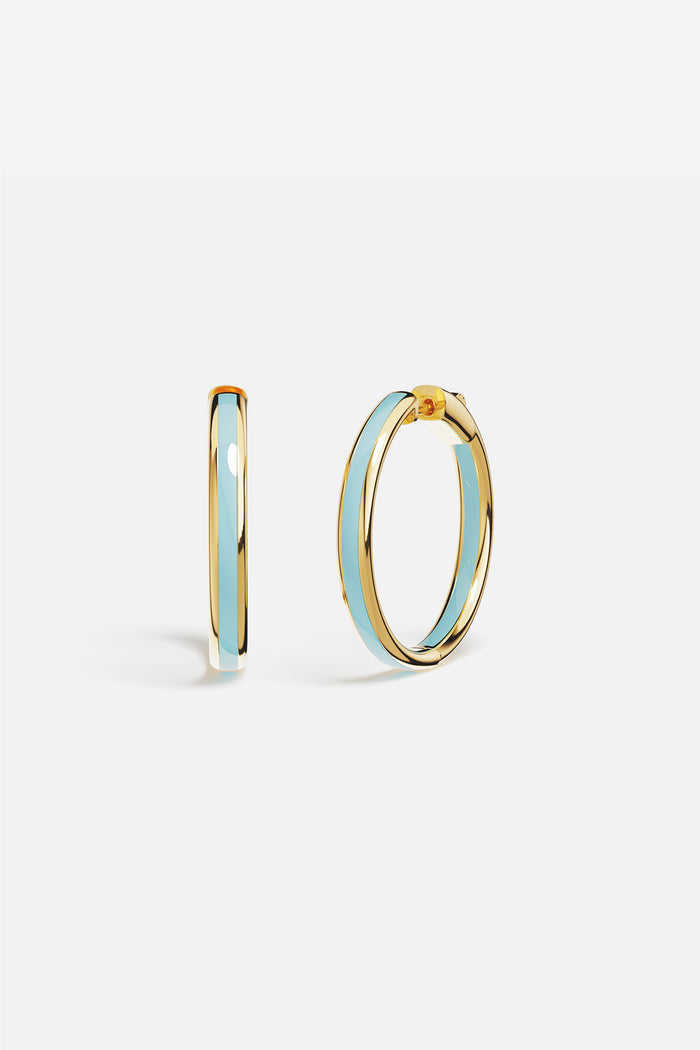 APM Hoop Earrings in golden hue with soft blue enamel, effortlessly radiant.