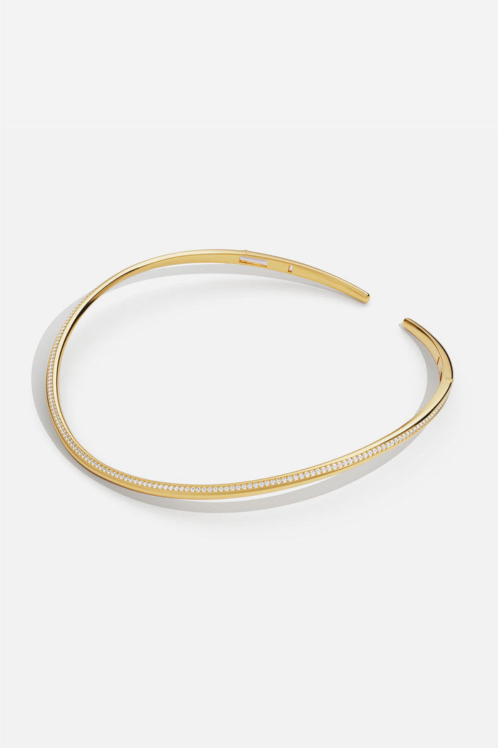 APM Choker in gold color, a sleek curve of modern elegance.