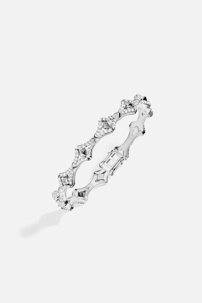 APM Ring, sculpted brilliance in rhodium finish, effortlessly luminous.