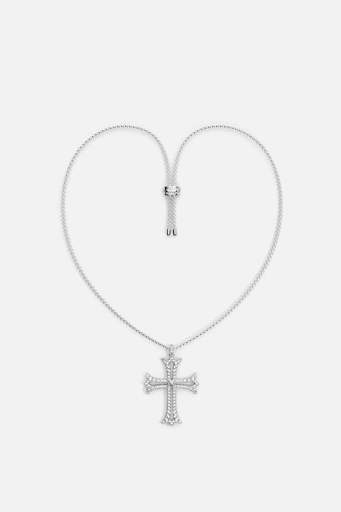 APM cross pendant necklace, a shimmering emblem of modern grace.