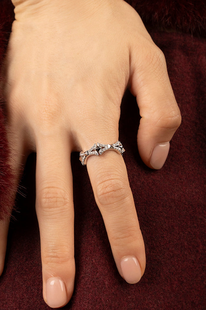 Woman wearing APM Morse Ring, a sparkling whisper of modern elegance.