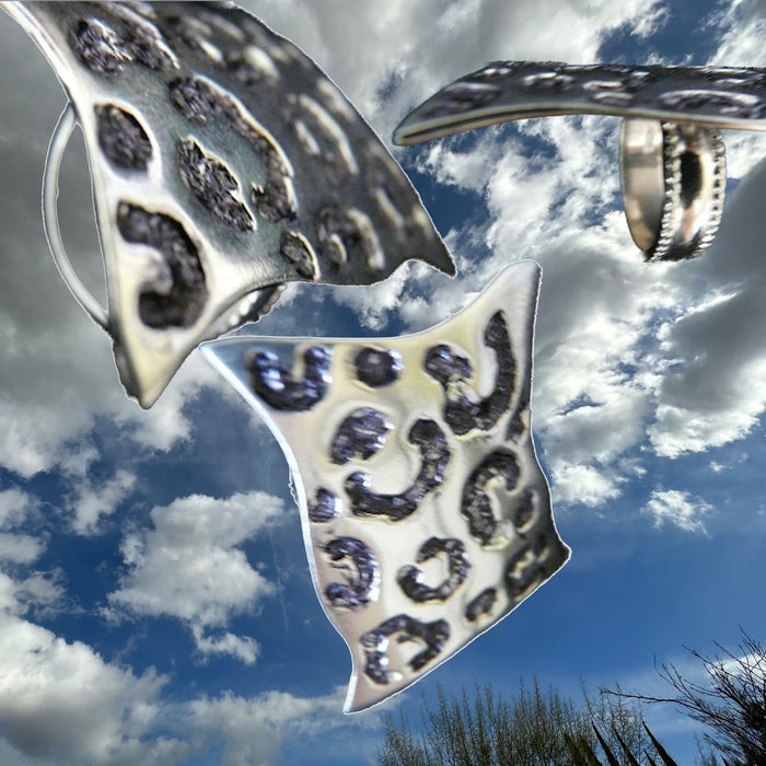 Side View of Sterling Silver Seeing Spots Leopard Ring.What can I say about this ring, except that it is PURRRfect? Shades of "Mad Men"! This ring brings back everything wonderful about the mid-60's--there is something simultaneously feminine and masculine about leopard skin. I mean, both Steven Tyler and Lady Gaga would be equally at home in fun statement piece. I'm so excited about this ring--for, as you know, my goal is to have my jewelry make you feel very special, and to create something you will want