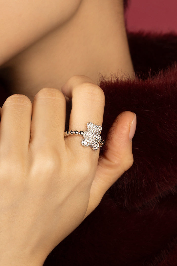 Woman wearing APM bear ring, playful sparkle meets soft everyday charm.
