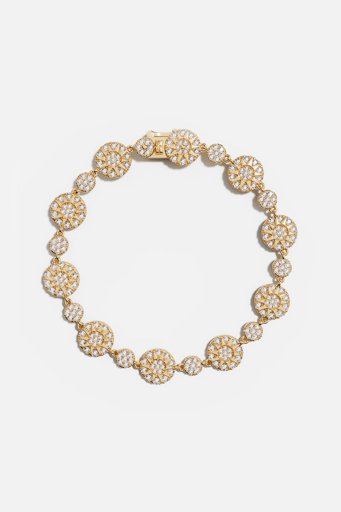 APM Bracelet in gold color, a radiant constellation of light around the wrist.