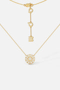 APM Monaco necklace in gold color, a radiant pavé medallion glowing with quiet charm.