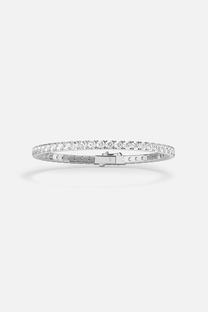 APM tennis bracelet in rhodium finish, a timeless sparkle for effortless elegance.