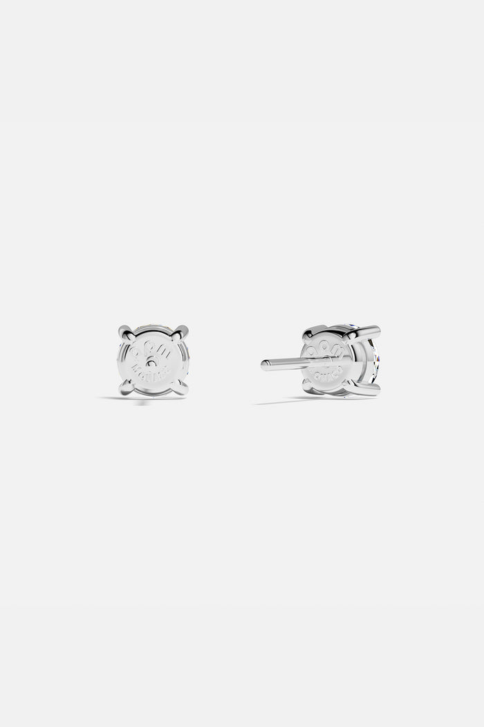 APM Stud Earrings, a timeless sparkle in rhodium finish, effortlessly radiant.