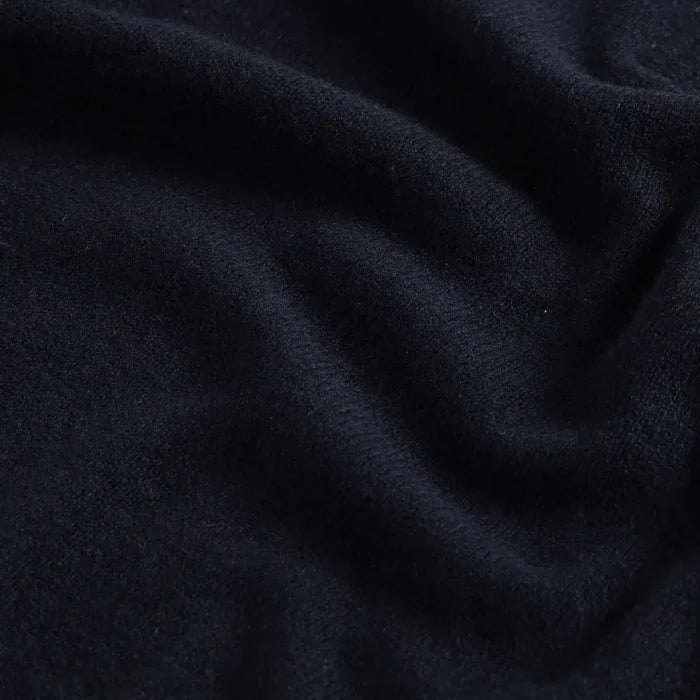 Close-up of 90% merino wool 10% cashmere fabric on the Navy Ashton quarter-zip sweater by Ledbury